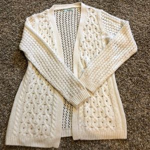 Maurice’s white cardigan sweater
